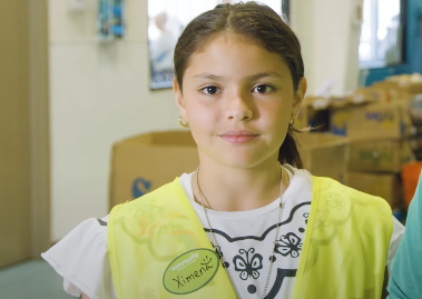 Young girl named Ximena wearing a yellow vest