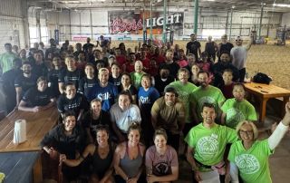 Corporate Challenge Volleyball Group Photo - Fuel Their Summer 2025